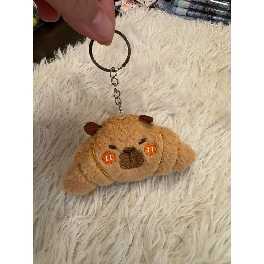 Capybara croissant plush keychain with embroidered  face and orange cheeks
